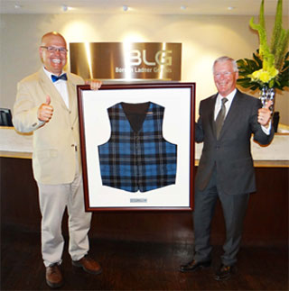 Rocco Rossi presents Alec Zimmerman with Blue Plaid Vest